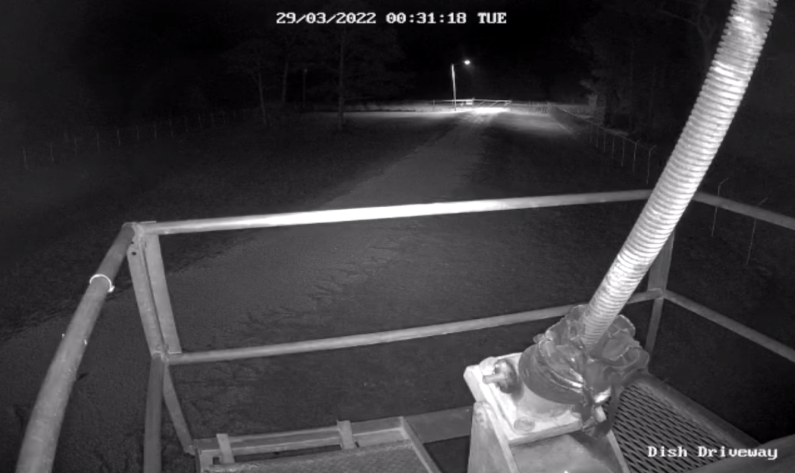 A nighttime view of the entrance to our property